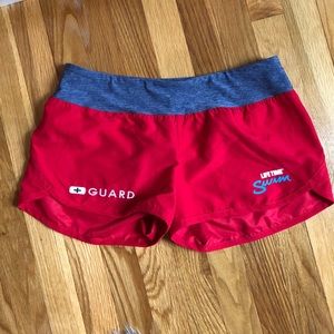 Red lifeguard shorts